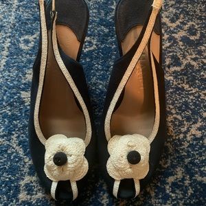 CHANEL Black Slingback Heels with Cream Camellia